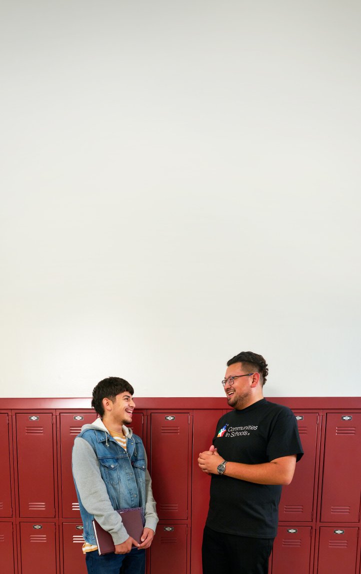 Student with globe and stack of books